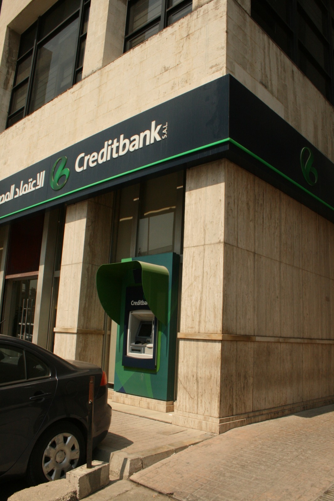 Creditbank S.A.L. branch with stone-clad facade and signage by GEM Corporate